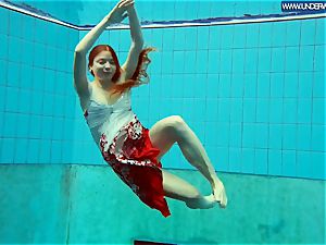 steaming polish redhead swimming in the pool